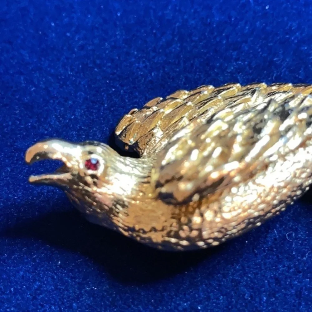 Vintage ‘60s gold tone Nesting eagle with red rhinestones